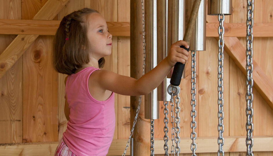 The Wusel Lake Trail The Wusel Lake Trail between Maurach and Achenkirch is a fantastic outdoor adventure playground for children. Here is a child at the sound station.