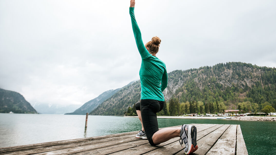 Do stretching exercises & enjoy the view of the lake & Alpen Caravan Park.