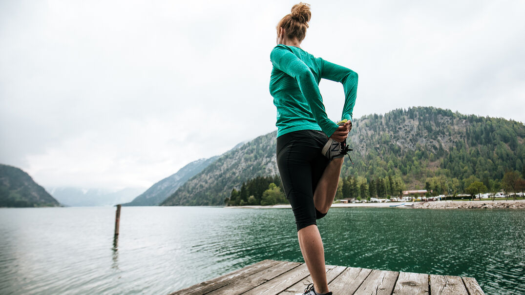 Do stretching exercises & enjoy the view of the lake & Alpen Caravan Park.