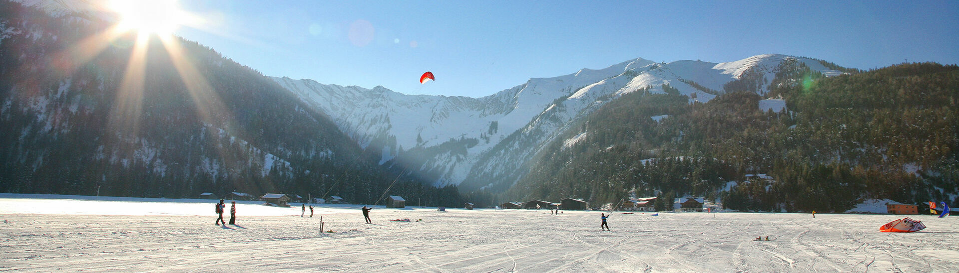 The winter version of kitesurfing is an exhilarating outdoor activity. Surfing over the snow with a kite is a must-do adventure for every sports enthusiast.