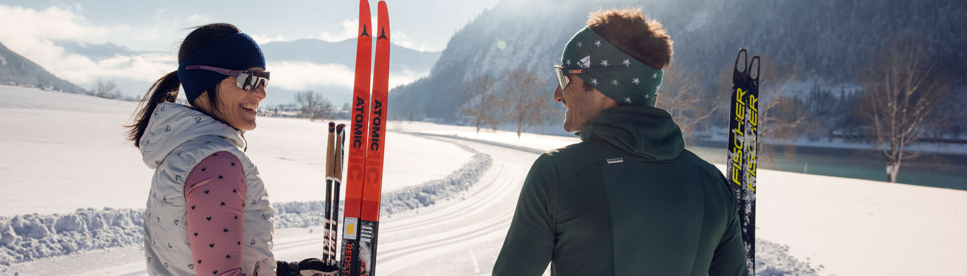 Cross-country skiing fun in Maurach at Achensee for a young couple.