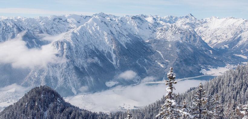 View from the Rofan mountains over the snow-covered Achensee region and the Nature Park Karwendel.
