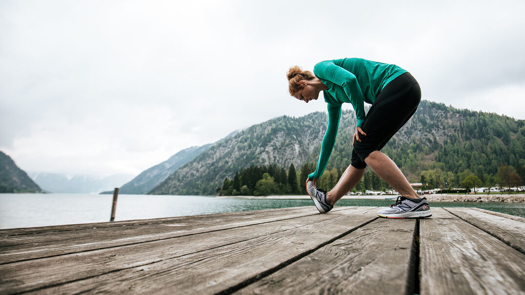 Do stretching exercises & enjoy the view of the lake & Alpen Caravan Park.