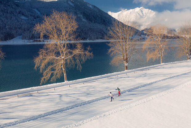 Cross-country ski over 228 kilometres of expertly groomed trails at Lake Achensee, Tirol's largest lake.