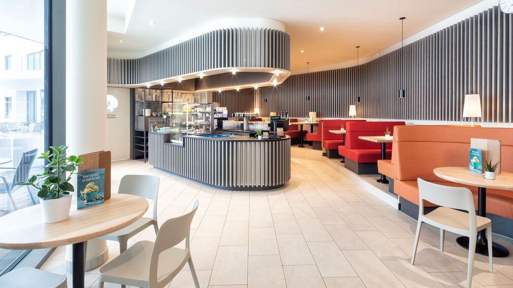 on a bubble lounger in the outdoor pool of the Panorama-BAD