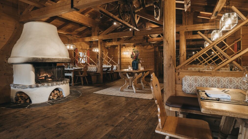 inside the Tirolerhütte – a laid table beside the open fire