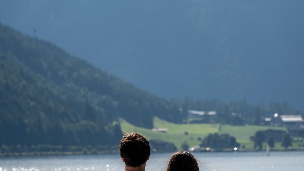 on a bubble lounger in the outdoor pool of the Panorama-BAD