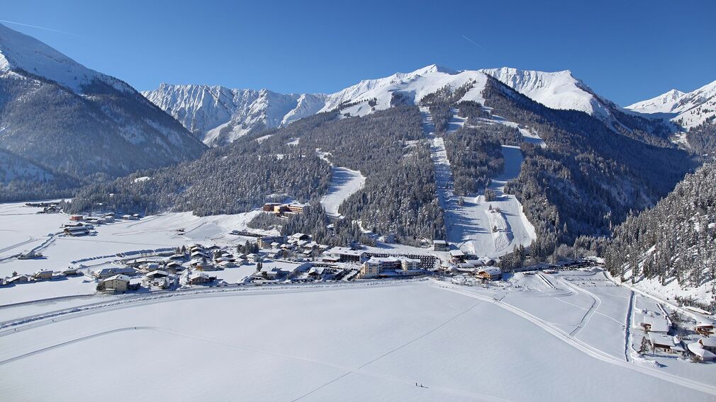 view of the ski area "Christlum" in Achenkirch with the entrance to the Unterautal valley