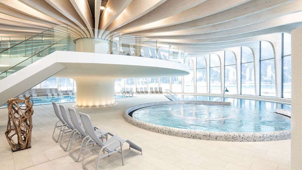 on a bubble lounger in the outdoor pool of the Panorama-BAD