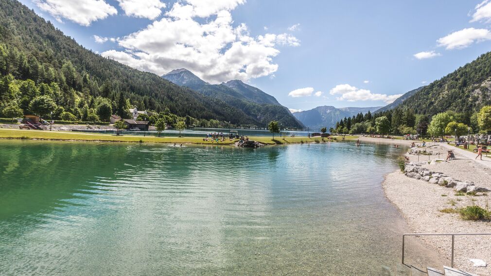 Children clearly enjoy themselves at the playground by the lake in Achenkirch.