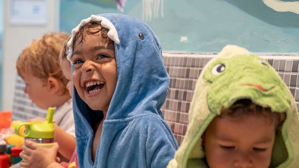 on a bubble lounger in the outdoor pool of the Panorama-BAD