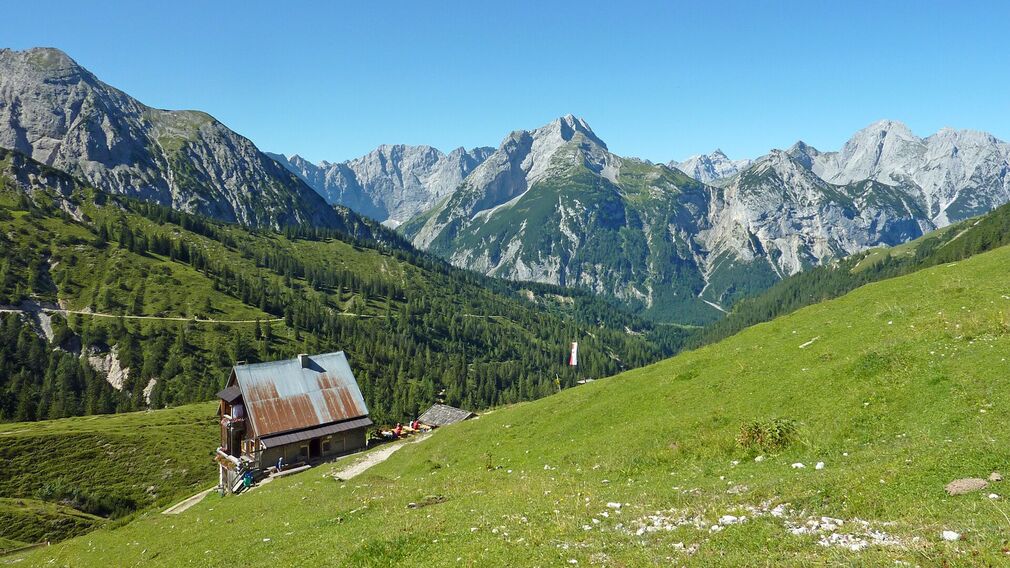 view from the 1,935 metre-high summit of the Satteljoch towards Lake Achensee and the Plumsjochhütte mountain hut