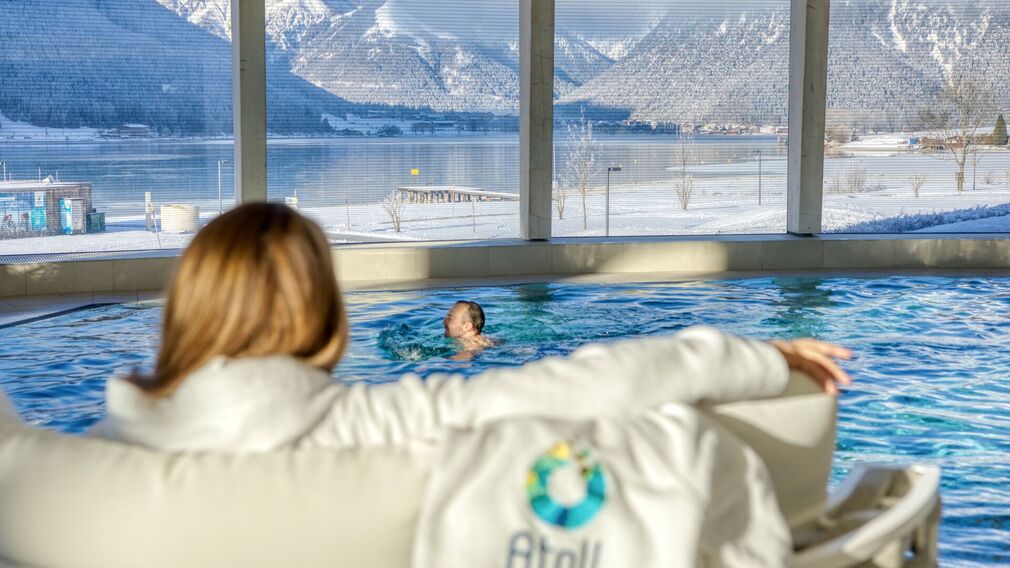 on a bubble lounger in the outdoor pool of the Panorama-BAD