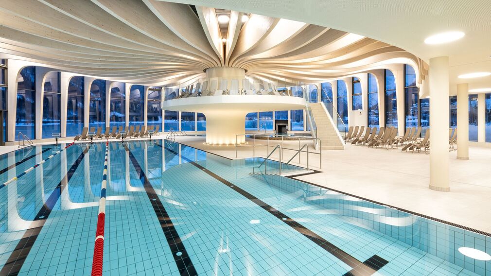 on a bubble lounger in the outdoor pool of the Panorama-BAD