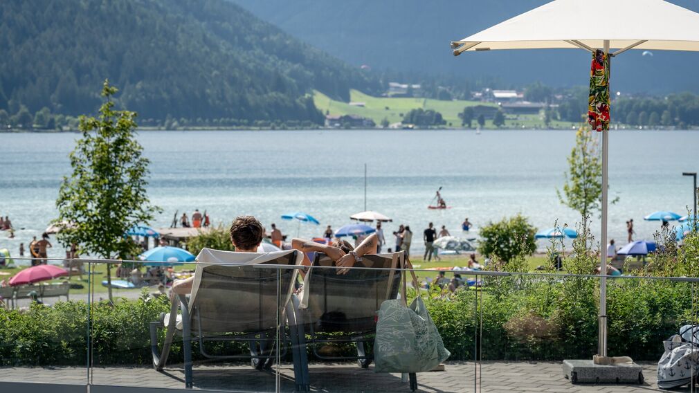 on a bubble lounger in the outdoor pool of the Panorama-BAD