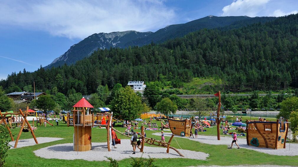 Children clearly enjoy themselves at the playground by the lake in Achenkirch.