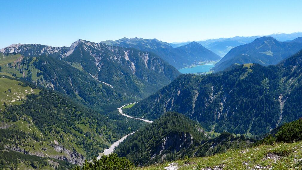 view from the 1,935 metre-high summit of the Satteljoch towards Lake Achensee and the Plumsjochhütte mountain hut